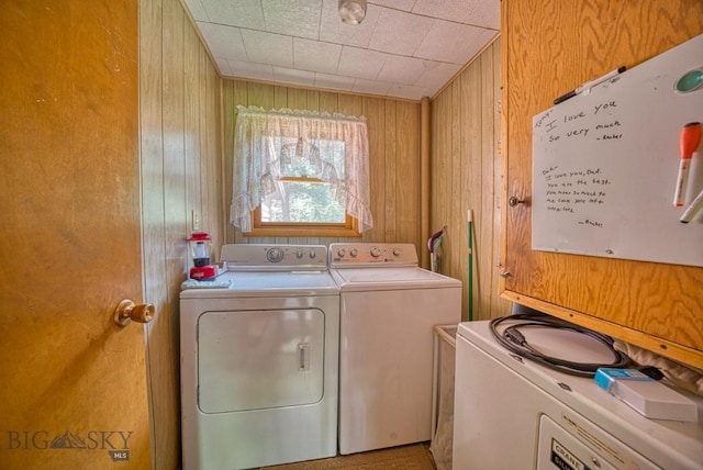14470 Cottonwood Canyon Rd, Bozeman, MT 59718 - laundry room featuring wood walls, laundry area, and independent washer and dryer