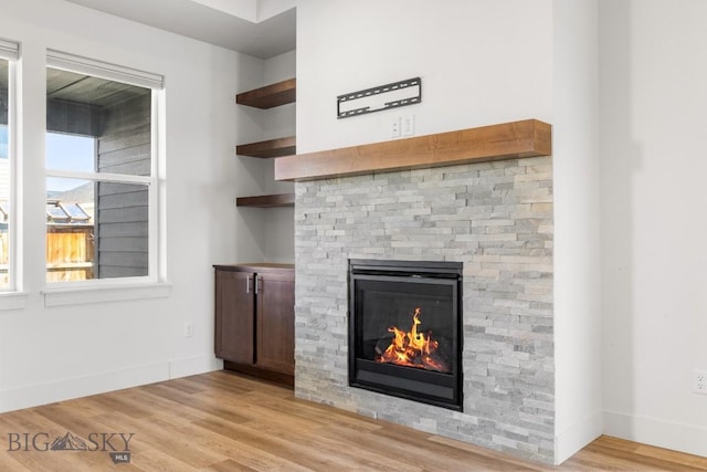 1511 Masterson, Belgrade, MT 59714 - interior details featuring baseboards, wood finished floors, and a fireplace