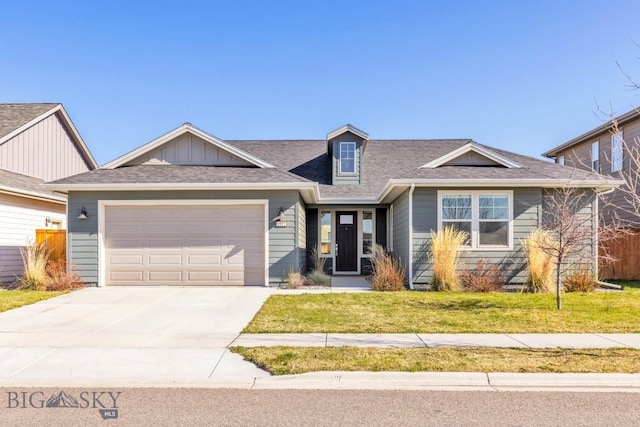 1511 Masterson, Belgrade, MT 59714 - craftsman-style home with roof with shingles, a front yard, concrete driveway, and an attached garage