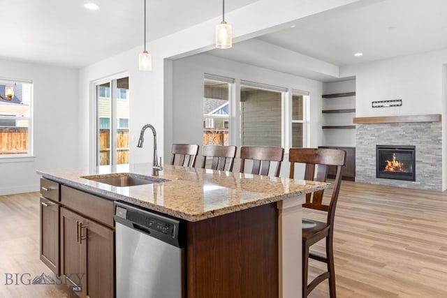 1511 Masterson, Belgrade, MT 59714 - kitchen with plenty of natural light, dishwasher, light wood-style flooring, and a sink