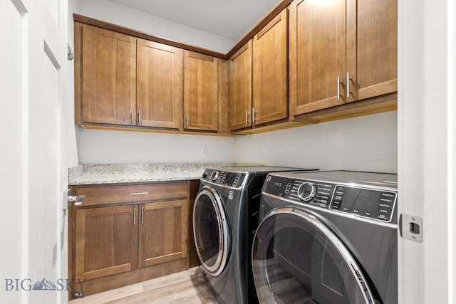 1511 Masterson, Belgrade, MT 59714 - laundry area with cabinet space, light wood-style flooring, and independent washer and dryer