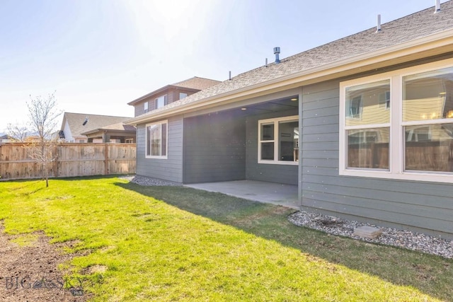 1511 Masterson, Belgrade, MT 59714 - rear view of house featuring fence, a yard, and a patio area