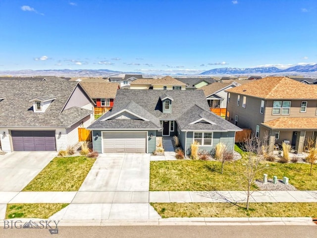 1511 Masterson, Belgrade, MT 59714 - view of front facade with a mountain view, a residential view, driveway, and a front yard