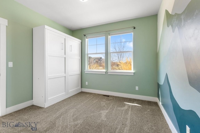 1511 Masterson, Belgrade, MT 59714 - unfurnished bedroom with carpet, visible vents, a closet, and baseboards