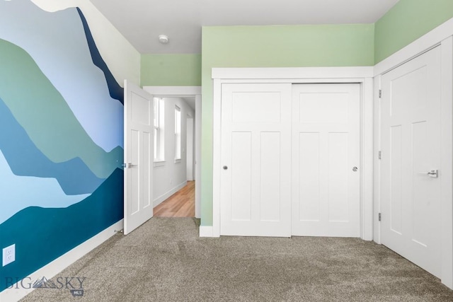 1511 Masterson, Belgrade, MT 59714 - unfurnished bedroom featuring a closet, carpet floors, and baseboards