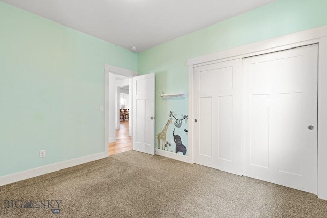1511 Masterson, Belgrade, MT 59714 - unfurnished bedroom featuring a closet, carpet, and baseboards