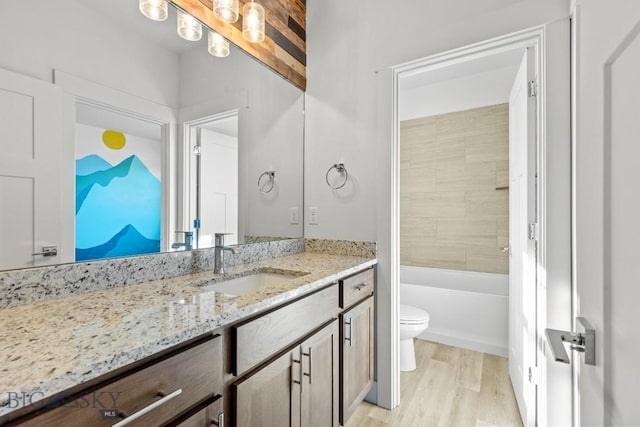 1511 Masterson, Belgrade, MT 59714 - bathroom featuring wood finished floors, toilet, and vanity