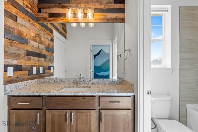 1511 Masterson, Belgrade, MT 59714 - full bathroom with toilet, wooden walls, and vanity