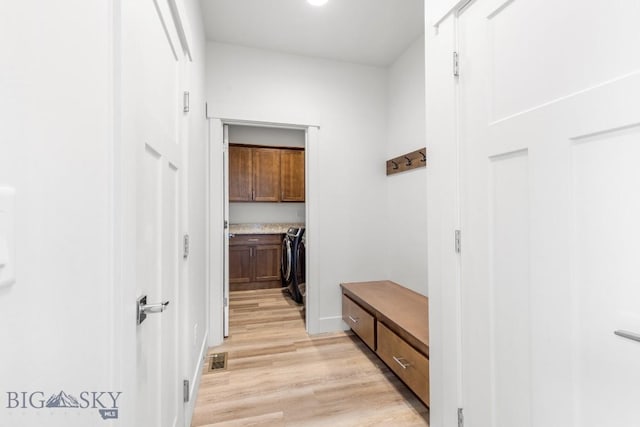1511 Masterson, Belgrade, MT 59714 - mudroom featuring visible vents, washer and clothes dryer, and light wood-type flooring