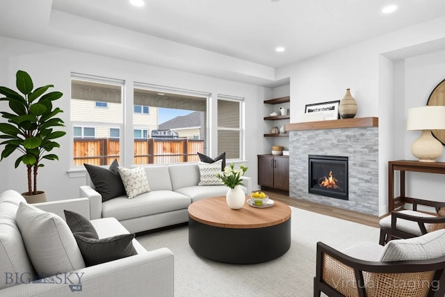 1511 Masterson, Belgrade, MT 59714 - living area with a tile fireplace, wood finished floors, and recessed lighting