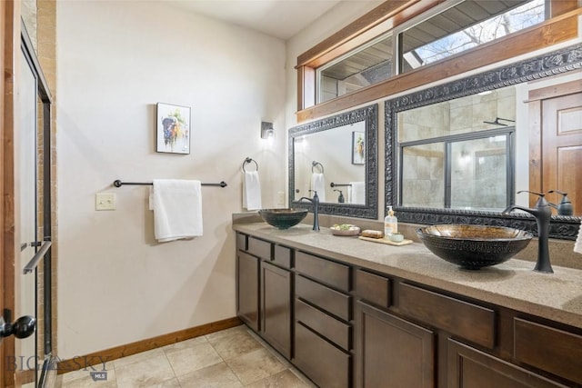 3383 Sora Way, Bozeman, MT 59718 - full bathroom featuring double vanity, a shower stall, tile patterned floors, and plenty of natural light
