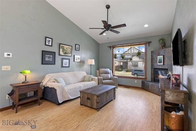 3383 Sora Way, Bozeman, MT 59718 - living area with ceiling fan, light wood-type flooring, a fireplace, high vaulted ceiling, and recessed lighting