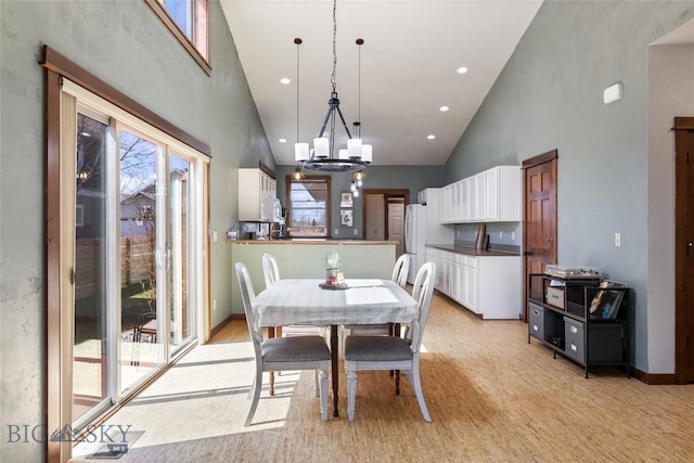 3383 Sora Way, Bozeman, MT 59718 - dining area featuring high vaulted ceiling, plenty of natural light, a chandelier, and recessed lighting