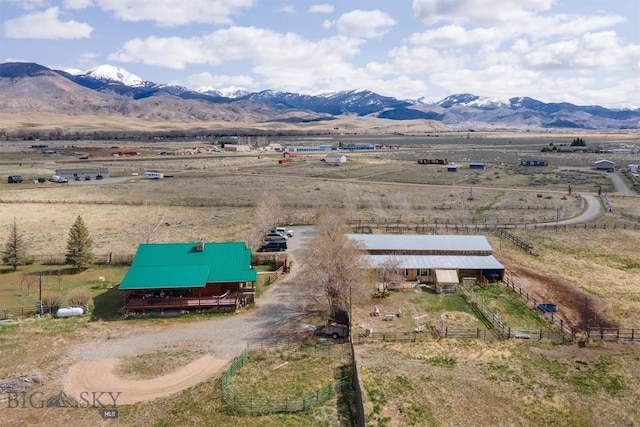 drone / aerial view with a mountain view and a rural view