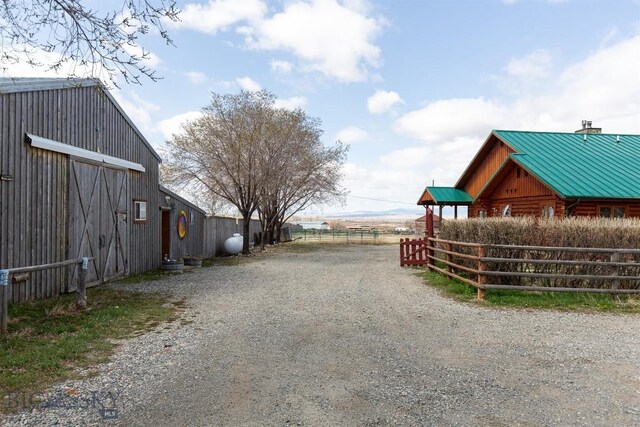 18 7m4r Rd, Sheridan, MT 59749 - view of dirt / gravel driveway featuring a barn
