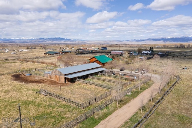 birds eye view of property featuring a mountain view and a rural view