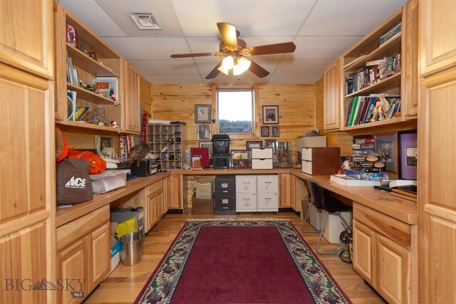 18 7m4r Rd, Sheridan, MT 59749 - office space featuring built in study area, ceiling fan, a paneled ceiling, wood walls, and light wood-style floors