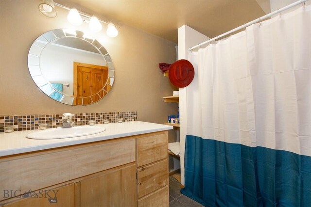 18 7m4r Rd, Sheridan, MT 59749 - bathroom featuring decorative backsplash, vanity, tile patterned flooring, and a shower with shower curtain