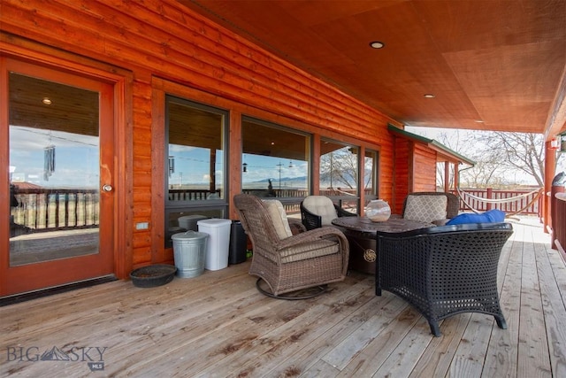 deck featuring outdoor dining area
