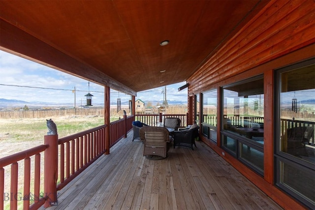 wooden terrace featuring a mountain view