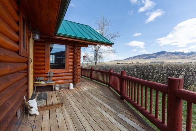 wooden terrace with a mountain view