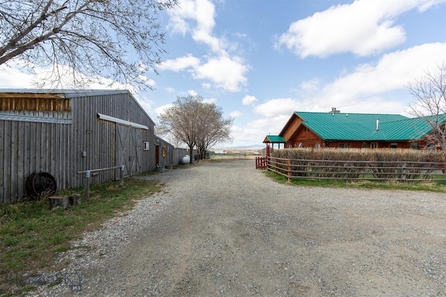 view of street featuring a barn
