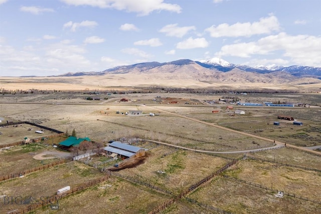 aerial view with a mountain view and a rural view
