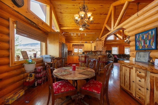 dining space with hardwood / wood-style flooring, rustic walls, high vaulted ceiling, and wooden ceiling