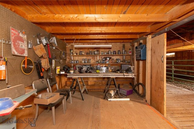 18 7m4r Rd, Sheridan, MT 59749 - bar area featuring a wood ceiling with exposed beams, a workshop area, and wood finished floors