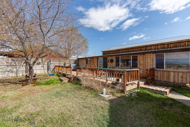 18 7m4r Rd, Sheridan, MT 59749 - back of property featuring a deck, a metal roof, and board and batten siding