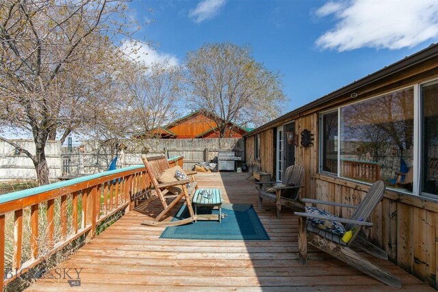 18 7m4r Rd, Sheridan, MT 59749 - wooden deck featuring a fenced backyard and a grill
