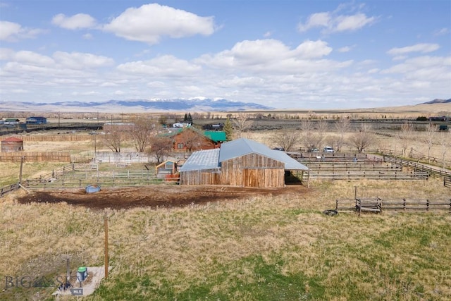 bird's eye view featuring a rural view and a mountain view