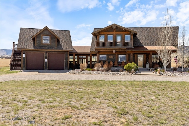6 Browtine Ln, Ennis, MT 59729 - view of front of home featuring a porch, roof with shingles, dirt driveway, and a front lawn