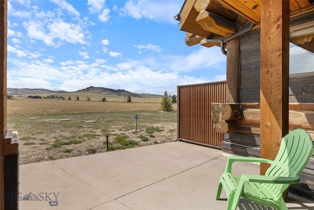 6 Browtine Ln, Ennis, MT 59729 - view of patio with a mountain view and a rural view