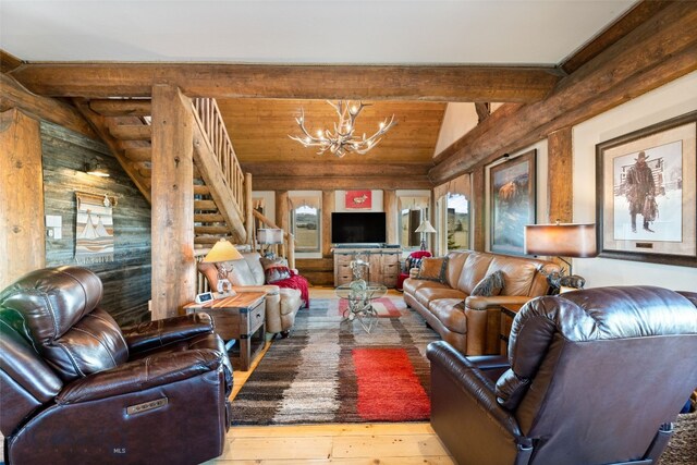 6 Browtine Ln, Ennis, MT 59729 - living room with a notable chandelier, stairway, vaulted ceiling with beams, and hardwood / wood-style flooring