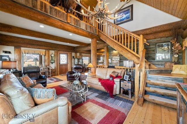 6 Browtine Ln, Ennis, MT 59729 - living room with beamed ceiling, stairway, a chandelier, hardwood / wood-style floors, and recessed lighting