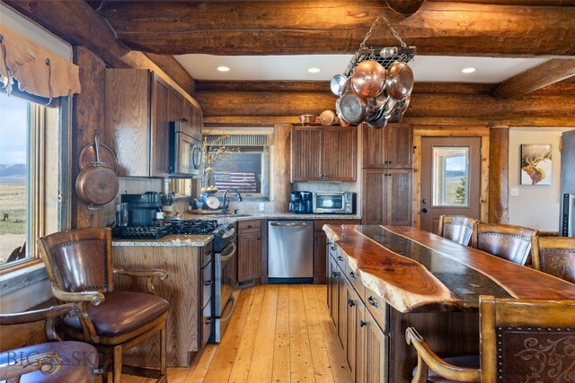 6 Browtine Ln, Ennis, MT 59729 - kitchen featuring beamed ceiling, recessed lighting, appliances with stainless steel finishes, and light wood-style floors