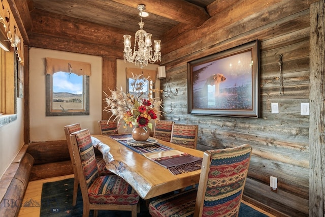 6 Browtine Ln, Ennis, MT 59729 - dining room with beam ceiling, wood finished floors, a notable chandelier, and wooden walls
