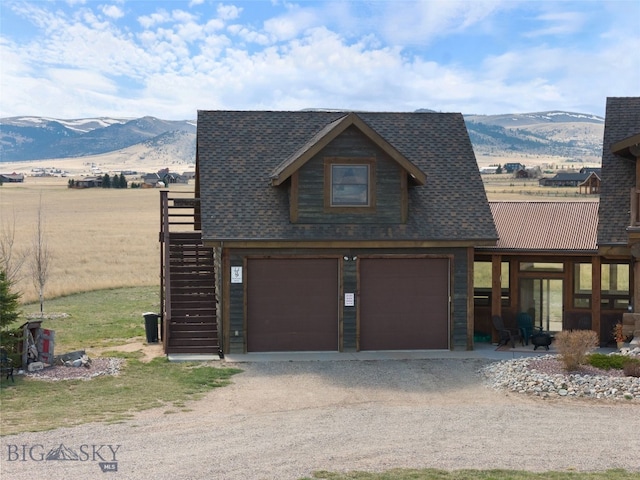 6 Browtine Ln, Ennis, MT 59729 - view of side of home featuring a mountain view, dirt driveway, stairway, and an attached garage