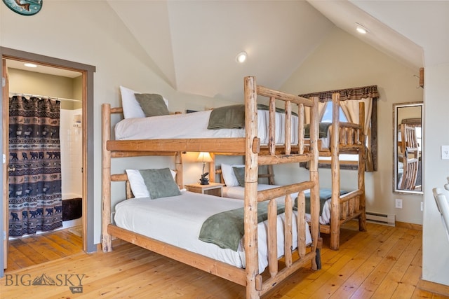 6 Browtine Ln, Ennis, MT 59729 - bedroom featuring baseboard heating, recessed lighting, wood-type flooring, and vaulted ceiling