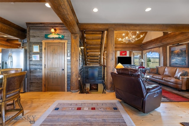 6 Browtine Ln, Ennis, MT 59729 - living room featuring beam ceiling, rustic walls, and hardwood / wood-style flooring