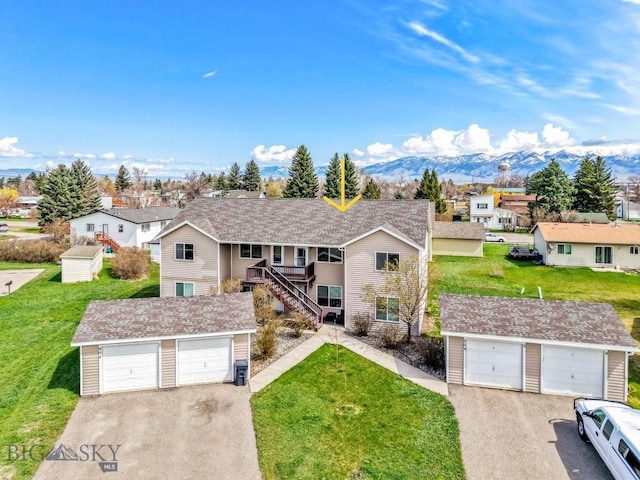 904 Jeanette Pl Unit 4, Belgrade, MT 59714 - ranch-style house featuring a front lawn, an outbuilding, a residential view, a detached garage, and a mountain view