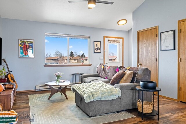 904 Jeanette Pl Unit 4, Belgrade, MT 59714 - living room featuring lofted ceiling, a baseboard radiator, baseboards, wood finished floors, and a ceiling fan