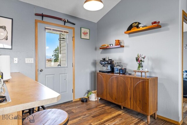 904 Jeanette Pl Unit 4, Belgrade, MT 59714 - entryway featuring wood finished floors, vaulted ceiling, and baseboards