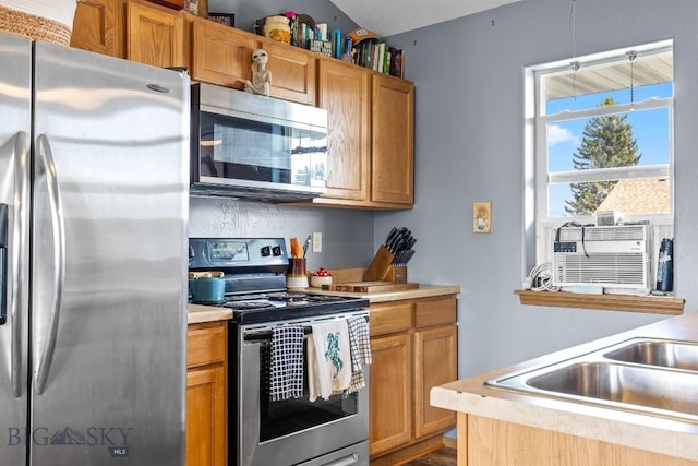 904 Jeanette Pl Unit 4, Belgrade, MT 59714 - kitchen with stainless steel appliances, cooling unit, and light countertops