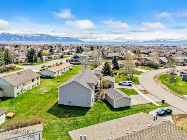 904 Jeanette Pl Unit 4, Belgrade, MT 59714 - drone / aerial view featuring a residential view and a mountain view