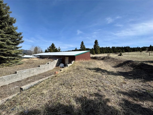 exterior space featuring an outdoor structure and an outbuilding