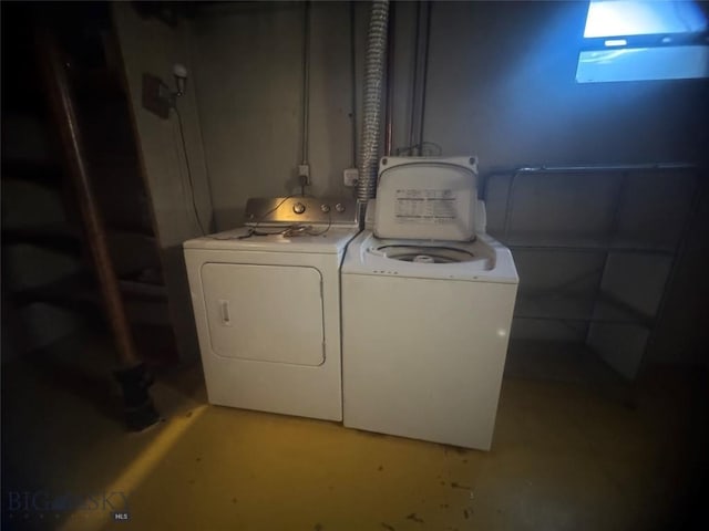 laundry room featuring separate washer and dryer and laundry area