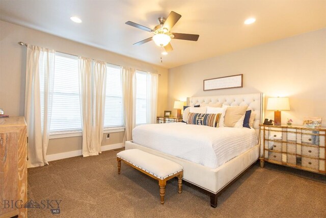 carpeted bedroom featuring recessed lighting, multiple windows, and baseboards