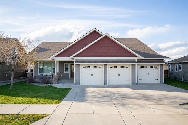 craftsman house featuring a front yard, a garage, covered porch, driveway, and roof with shingles